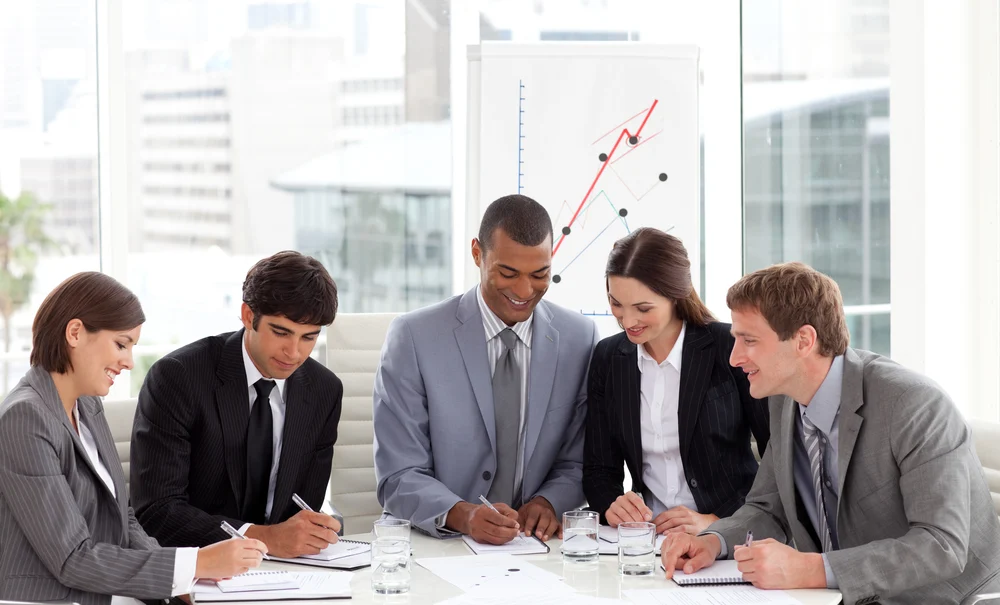 Multi ethnic business team working together in a meeting